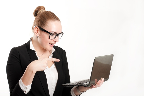 Woman with laptop on a light background - Zdjęcie, obraz