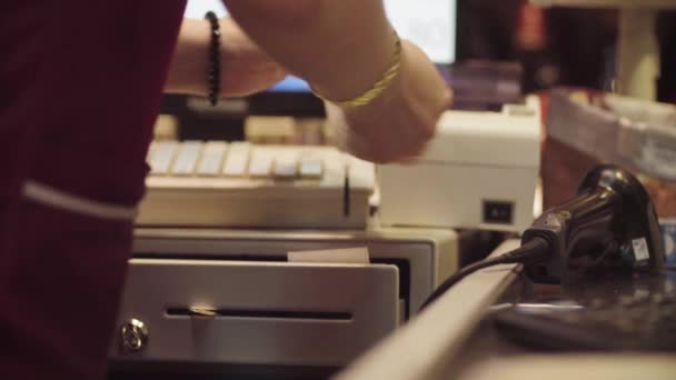 Hands of woman working on cash register - Footage, Video