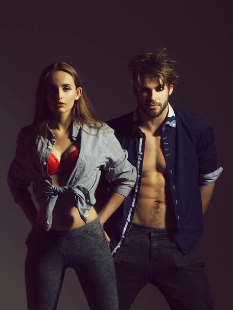 Young couple in unbutton shirts - Zdjęcie, obraz