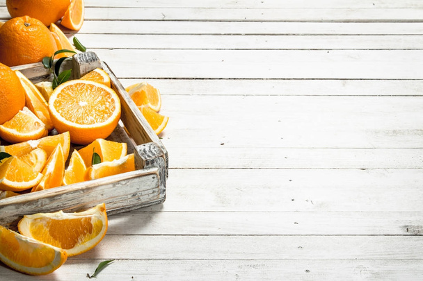 Fresh oranges in a box. - Фото, изображение