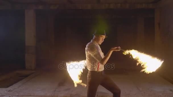 Male artist performing fire show at dark in slow motion. - Video, Çekim