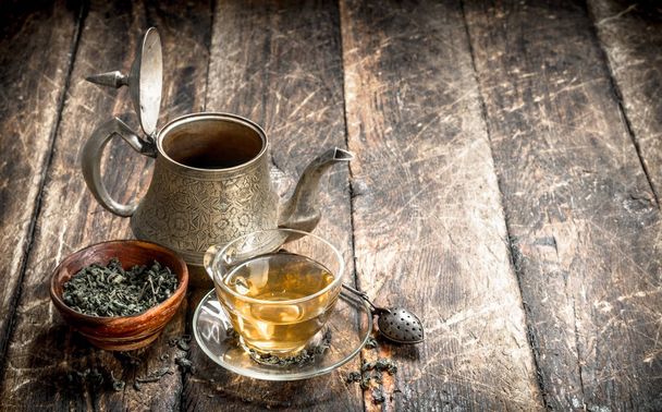 Teapot with fragrant Indian tea. - Photo, Image