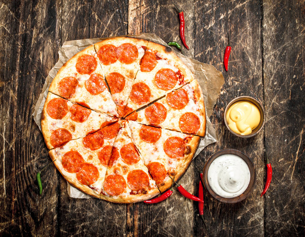 Pepperoni pizza with sauces. - Zdjęcie, obraz