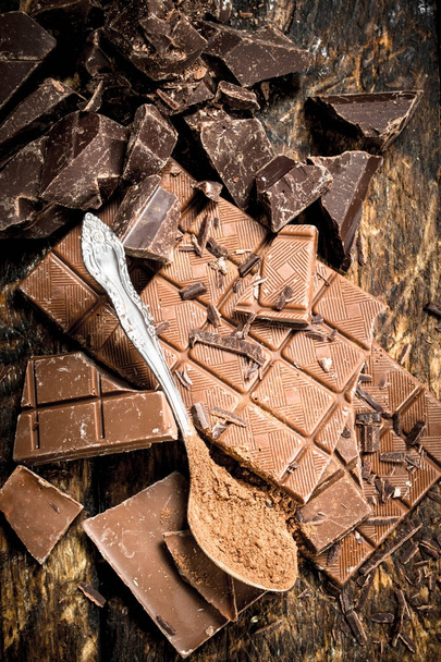 Chocolate bars with cocoa powder. - Photo, Image