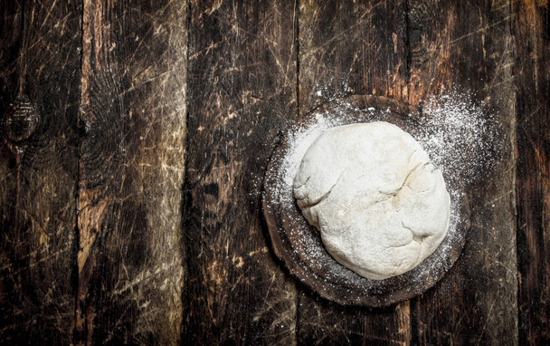Fresh dough on board. - Photo, Image
