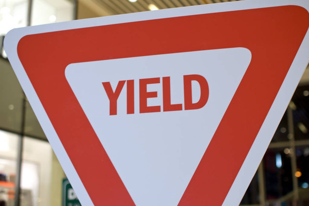 A red and white inverted triangle yield sign - Photo, Image