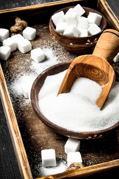 Sugar on an old wooden tray. - Photo, Image