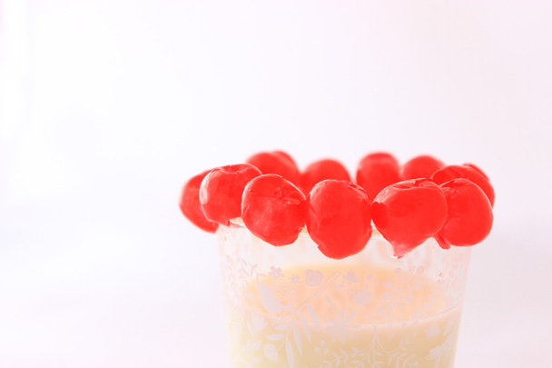 Cherries over milk glass - Photo, Image