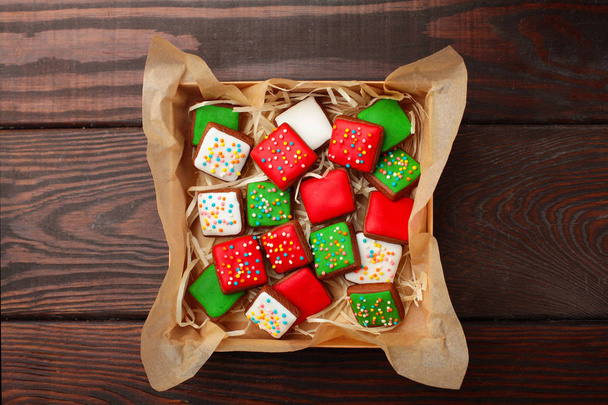 Open box Christmas different colour cookies on a old wooden table.Copy space - Фото, зображення