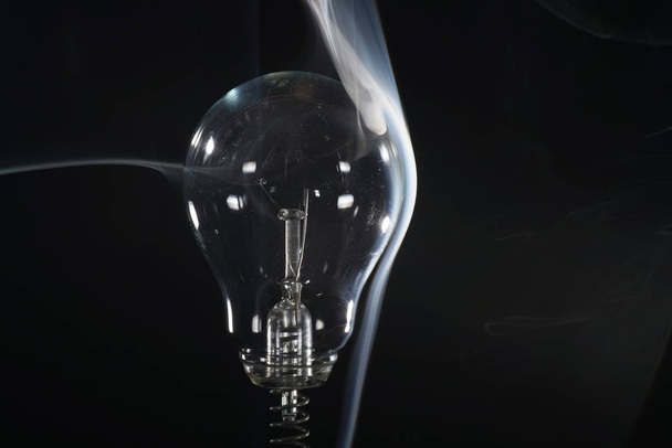 Lightbulb with smoke showing aerodynamics also suitable as a background - 写真・画像