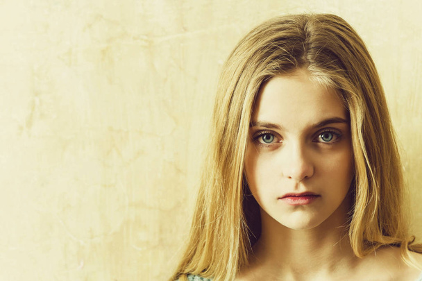 Pretty young girl with blond hair and big blue eyes - Fotografie, Obrázek