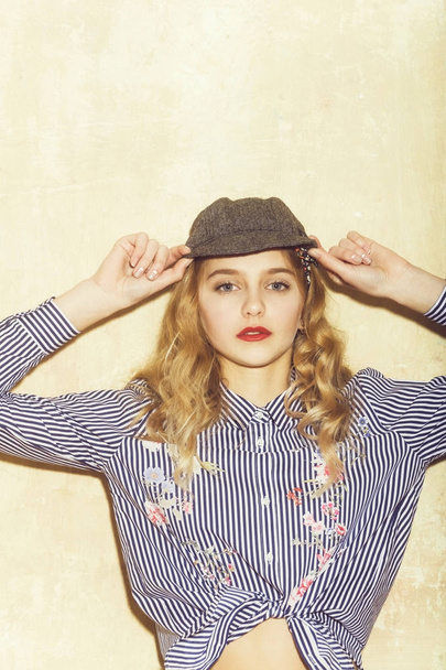 Pretty girl in blue striped shirt and grey cap - Zdjęcie, obraz
