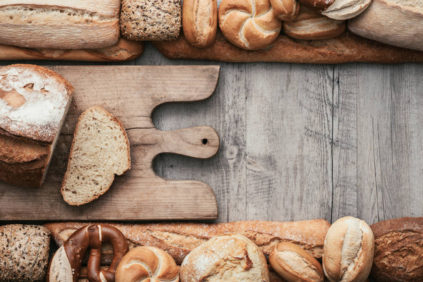 Bread on a rustic worktop - Fotografie, Obrázek