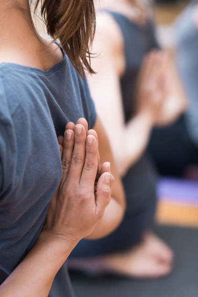 Women practicing yoga: reverse prayer pose - 写真・画像