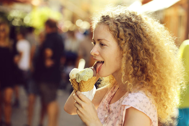 Smiling woman with ice cream - Zdjęcie, obraz