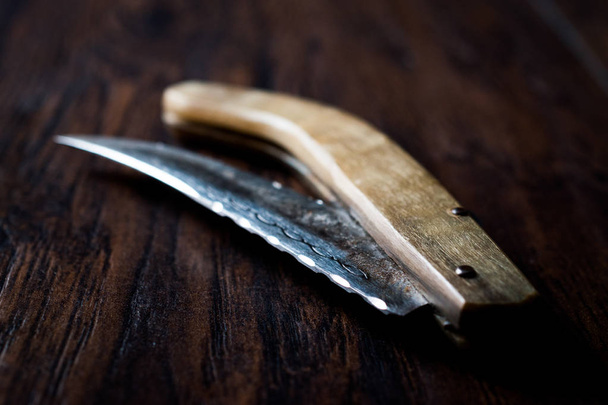 Handmade Wooden Pocket Knife on Dark Surface. - Valokuva, kuva