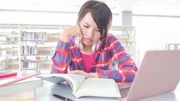 woman student in the library - Photo, Image