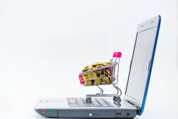 Shopping cart or supermarket trolley with laptop notebook on whi - Fotoğraf, Görsel