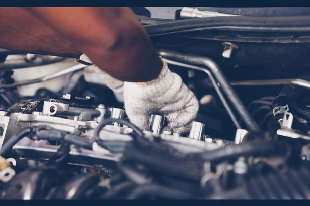 Hands of auto mechanic repairing car. Selective focus. - Photo, Image