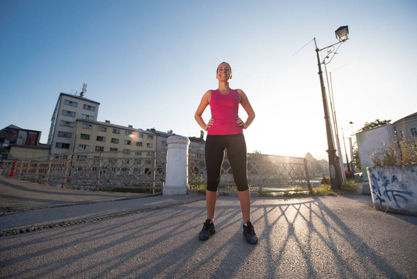portrait of a jogging woman at sunny morning - Fotoğraf, Görsel