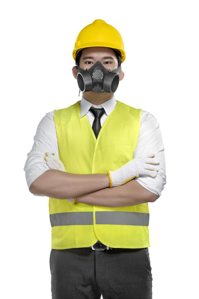 Portrait of asian foreman with yellow helmet posing isolated over white background - Foto, afbeelding