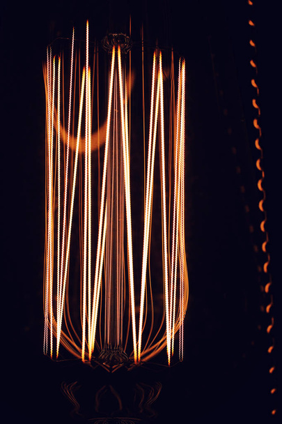 Lamps with tungsten filament. Edisons light bulb. Filament fila - Фото, изображение
