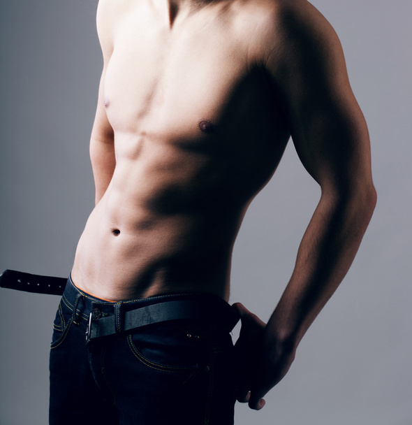 Muscular young sexy nude man on studio - Fotografie, Obrázek