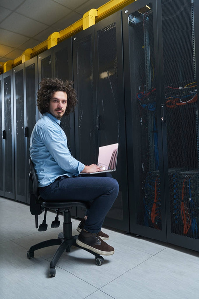 Young technician working  in server room - Photo, Image