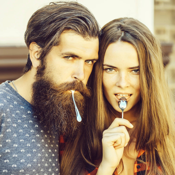 young couple with tea spoon - Valokuva, kuva