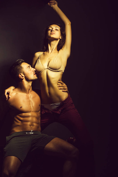 sexy young couple in studio - 写真・画像