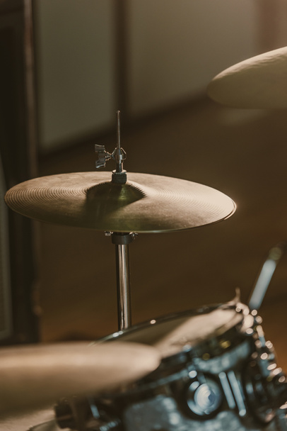 close-up shot of drum cymbals under spotlight on stage - Photo, Image