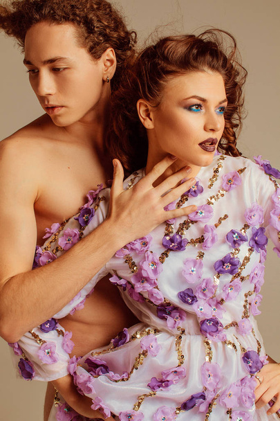 Beautiful and sensual couple with curly hair and make-up - Photo, Image
