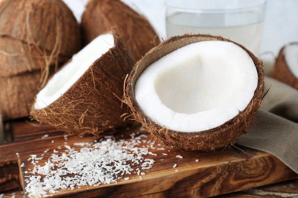 Fresh coconuts on wooden board - Фото, изображение
