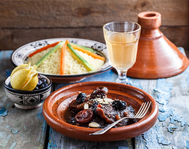 Closeview of tajine of beef with prunes and almonds. In tradiotional Moroccan dish. - Photo, Image