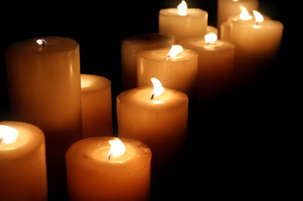 Many burning candles on dark background - Photo, image