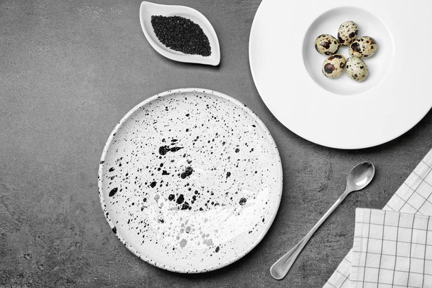 Set of dinnerware with ingredients on grey background - Zdjęcie, obraz
