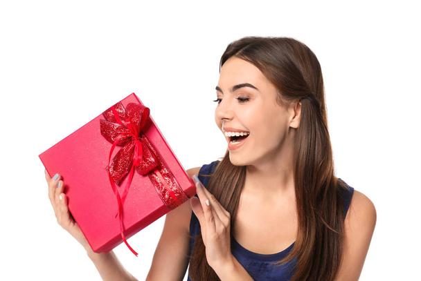 Beautiful young woman with gift for Valentine's Day on white background - Zdjęcie, obraz