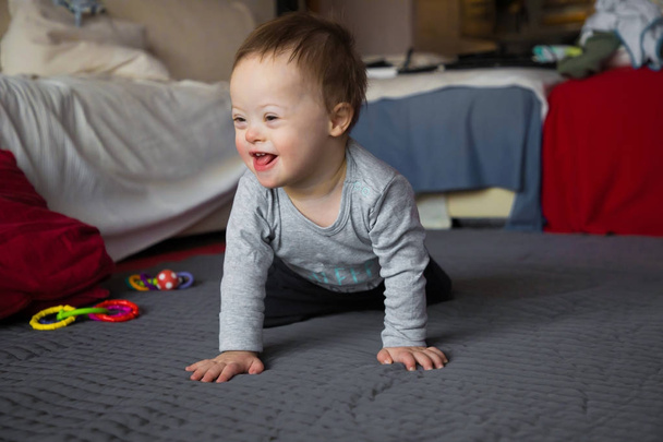 Portrait of cute baby boy with Down syndrome - 写真・画像