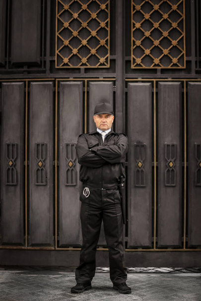 Male security guard standing outdoors - Fotoğraf, Görsel