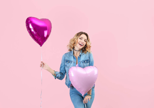 woman with heart shaped air balloons - Fotó, kép