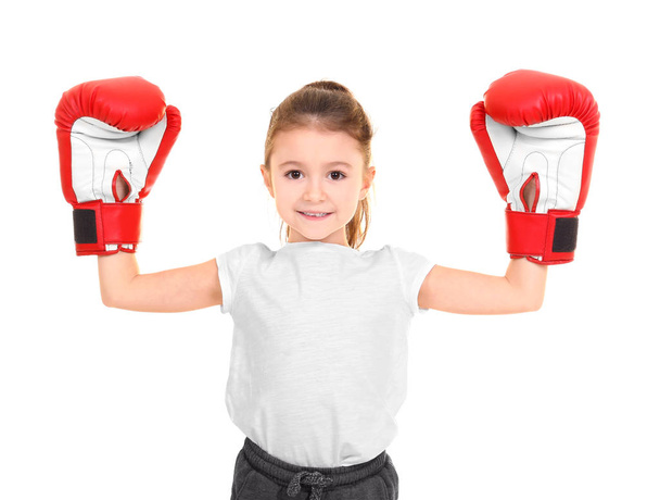 Cute little girl in boxing gloves on white background - Photo, image