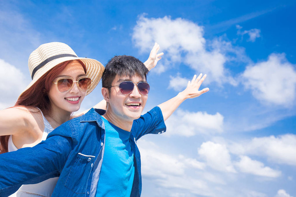 couple feeling  free on  blue sky background - Valokuva, kuva