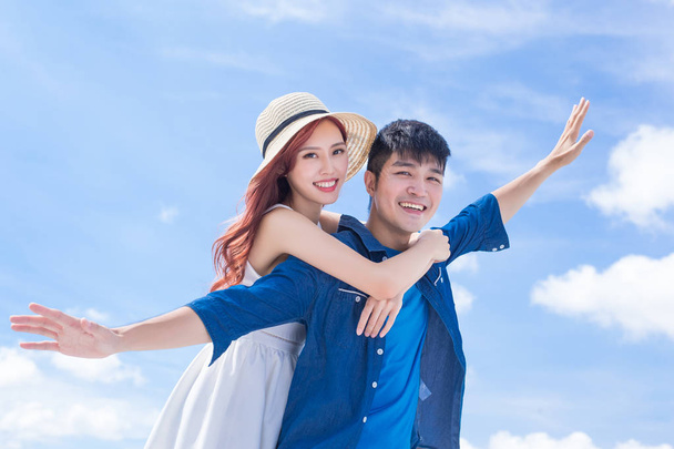 couple feeling  free on  blue sky background - Foto, immagini