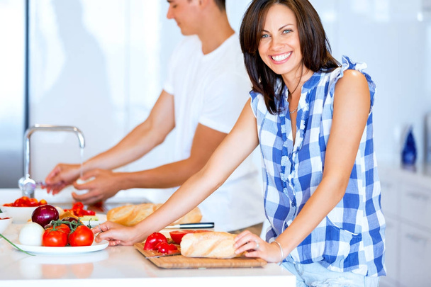 Couple cooking together at home - Foto, imagen