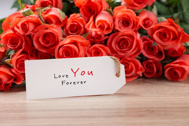 Valentine's Day Background with Bouquet of red roses - Foto, Imagen