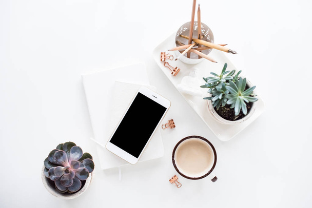 office desk flat lay with coffe, smartphone and succulents, clea - Φωτογραφία, εικόνα