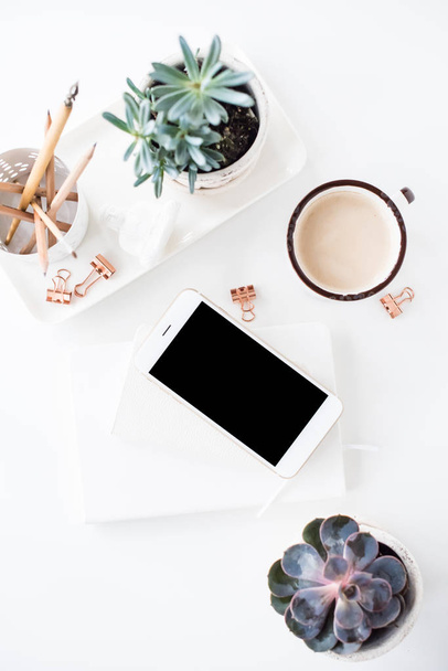 office desk flat lay with coffe, smartphone and succulents, clea - Φωτογραφία, εικόνα