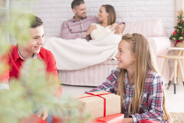 Young family in the christmas morning - 写真・画像