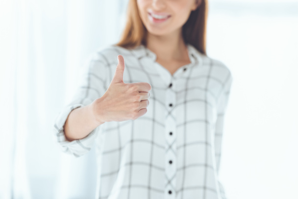 cropped image of businesswoman showing thumb up - Photo, image