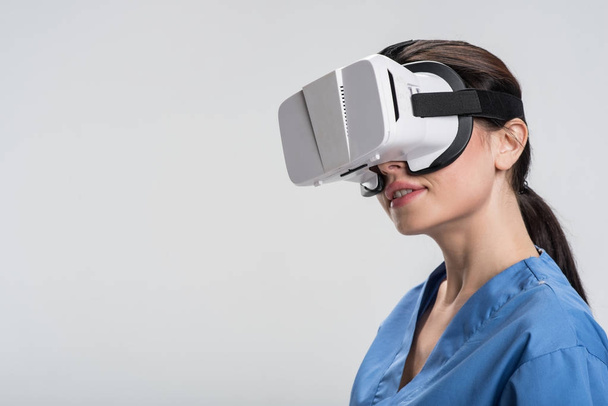 Cheerful female doctor surprising with VR - Foto, immagini